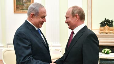 Russian President Vladimir Putin, right, shakes hands with Israeli Prime Minister Benjamin Netanyahu during their meeting at the Kremlin in Moscow, Wednesday, July 11, 2018. (AP)