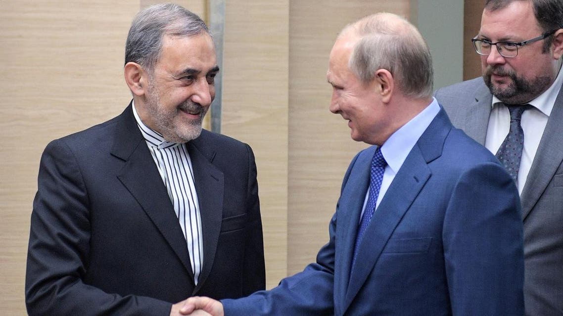 Putin and Velayati (AFP)