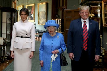 Queen Elizabeth with US President Donald Trump and his wife, Melania in the Grand Corridor during their visit to Windsor Castle. (Reuters)