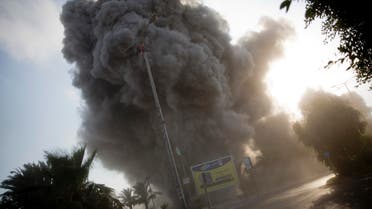 Smoke raises in the background following an Israeli airstrike hits a governmental building in Gaza City , Saturday, July 14, 2018. (AP)