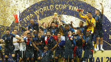 France players celebrate with the trophy after winning the World Cup. (Reuters)
