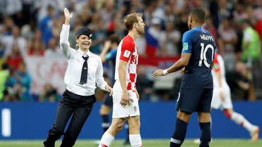 A pitch invader, Croatia's Ivan Strinic and France's Kylian Mbappe. (Reuters)