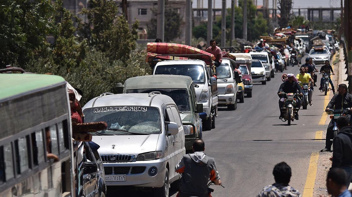 Displaced Syrians from the Daraa province come back to their hometown in Bosra, southwestern Syria, on July 11, 2018. (AFP)