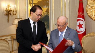 Tunisia PM says changing the government now will hurt the economy