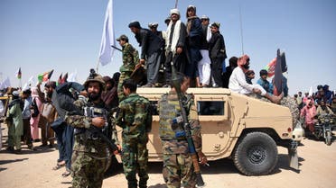 Afghan Taliban militants and residents celebrate ceasefire in Kandahar on June 17, 2018. (AFP)