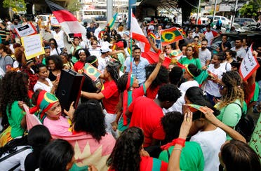 Migrant domestic workers dance during a rally to mark International Domestic Workers Day, in Beirut, Lebanon, Sunday, June 24, 2018. The protesters are demanding that the Kafala, or sponsorship law, be abolished, and called for better treatment. The Kafala system ties workers to their employers whose consent is needed for renewal of residency permits, changing jobs or for workers to return home. (File photo: AP) 