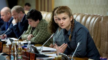 Public figure Maria Butina (R) attends a meeting of a group of experts, affiliated to the government of Russia, in this undated handout photo. (Reuters)