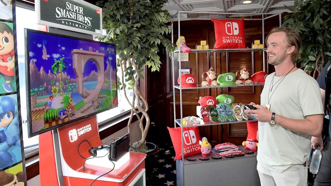 Tom Felton tests his skills on Super Smash Bros. Ultimate for Nintendo Switch at the Variety Studio at Comic-Con 2018 on July 19, 2018 in San Diego, California. (AFP)