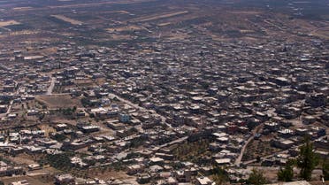 This picture shows the city of Quneitra after Syrian government forces took it back to the rebels, on July 19, 2018. Under pressure, rebels have agreed to hand over Quneitra and the buffer to government forces, an opposition negotiator and a monitoring group told AFP on July 19.