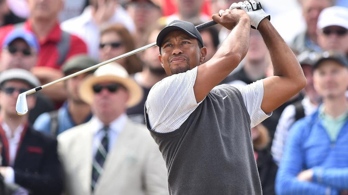 US golfer Tiger Woods watches his iron shot from the 5th tee during his third round on day 3 of The 147th Open golf Championship at Carnoustie, Scotland on July 21, 2018. (AFP)