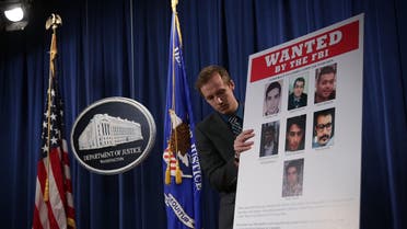 صور للقراصنة السبعة الذين وجهت إليهم اتهامات، خلال مؤتمر صحافي بواشنطن في 2016