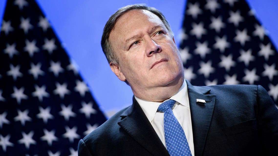 Mike Pompeo looks on as President Trump addresses a press conference on July 11. (AFP)