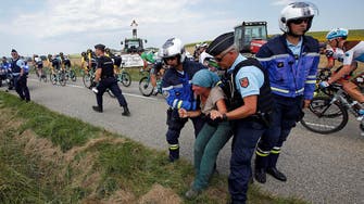 Tour de France briefly interrupted by farmers’ protest