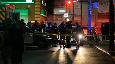 Police are seen near the scene of a mass shooting in Toronto. (Reuters)