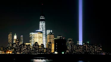 The “Tribute in Light” shines from the Manhattan skyline next to One World Trade Center on 9/11 on September 11, 2013 in Hoboken, New Jersey. (AFP)