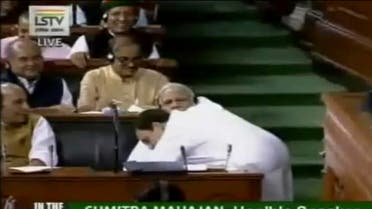 Rahul Gandhi hugging Prime Minister Modi during parliament proceedings in New Delhi on July 20, 2018. (Lok Sabha Television via AP)