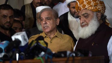 Shahbaz Sharif (L), the younger brother of ousted Pakistani Prime Minister Nawaz Sharif and head of Pakistan Muslim League-Nawaz (PML-N), speaks during a press conference as Pakistani opposition leader Maulana Fazalur Rehman (R) listens on after attending an All Parties Conference in Islamabad on July 27, 2018. (AFP)