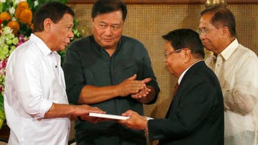 Philippine President Rodrigo Duterte, left, receives the draft of the Bangsamoro Basic Law from Ghazali Jaafar, vice-chair of the Moro Islamic Liberation Front (MILF), during a ceremony at Malacanang Palace Monday, July 17, 2017 in Manila, Philippines. (AP)