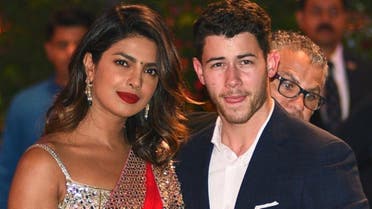 Indian Bollywood actress Priyanka Chopra (L) accompanied by Nick Jonas arrive for the pre-engagement party of India's richest man and Reliance Industries Limited Chairman, Mukesh Ambani’s eldest son Akash Ambani and fiancee Shloka Mehta in Mumbai on June 28, 2018. (AFP)