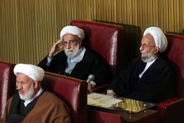 Ayatollah Ahmad Jannati, center, and Mesbah Yazdi, right, attend the fourth assembly in Tehran on March 8, 2016. (AP)