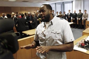 Former Detroit Mayor Kwame Kilpatrick speaks to the media while being led out of court in Detroit, Wednesday, June 15, 2011 AP