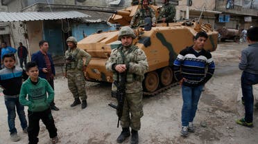 Turkish soldiers secure the streets of Afrin during a Turkish government-organized media tour into northern Syria on March 24, 2018. (AP)