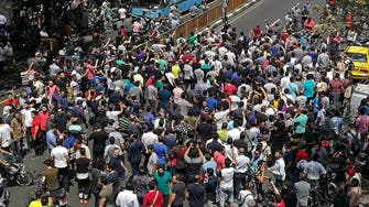 Iran protesters attack religious school in province near Tehran