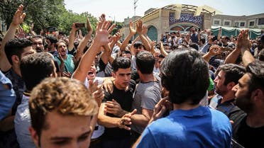 A group of protesters chant slogans at the main gate of old grand bazaar in Tehran, Iran,on June 25, 2018. (AP)