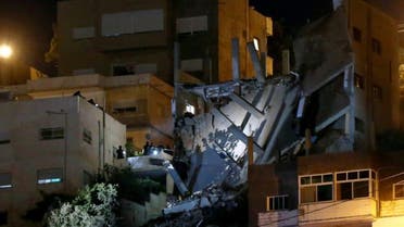 Security forces are seen near a damaged building one day after the security incident, at the city of Al Salt, Jordan, August 11, 2018. (Muhammad Hamed/Reuters)