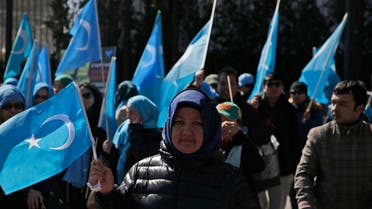 Uighurs and their supporters rally across the street from United Nations headquarters in New York, Thursday, March 15, 2018. (AP)