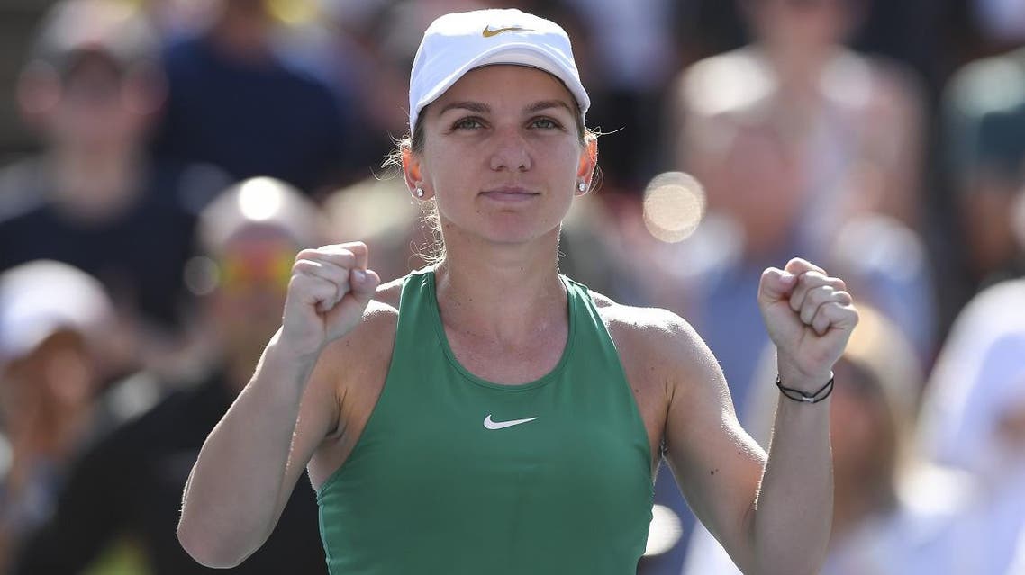 Simona Halep of Romania celebrates her 7-6, 3-6, 6-4 victory against Sloane Stephens in the final during day seven of the Rogers Cup on August 12, 2018 in Montreal, Quebec, Canada. (AFP)