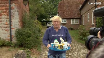 WATCH: Boris Johnson avoids burqa drama by offering journalists cups of tea