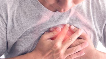 A Man having chest pain, heart disease. - Stock image
