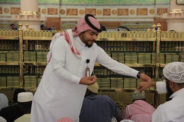 Pictures show some of the employees welcoming Hajj pilgrims by applying musk perfume on their hands, celebrating their arrival to this holy area. (Supplied)