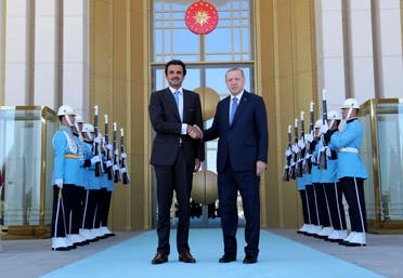 Turkey's President Recep Tayyip Erdogan, right, and Qatar's Emir Sheikh Tamim bin Hamad Al Thani shake hands before their talks in Ankara, Turkey, Wednesday, Aug. 15, 2018. (AP)