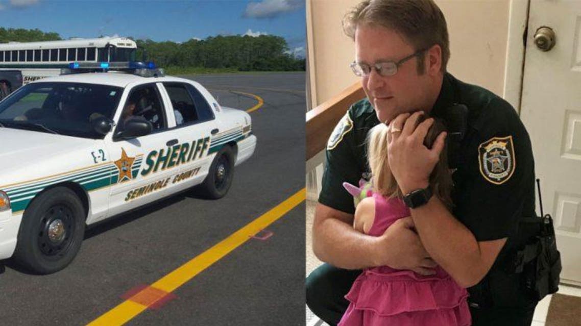 A dash camera shows Deputy Bill Dunn running to save the girl after he had received reports of her being inside the car. (Supplied)