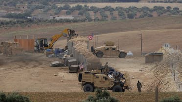 A picture taken on May 8, 2018 shows vehicles and structures of the US-backed coalition forces in the northern Syrian town of Manbij. The Syrian Observatory for Human Rights, a Britain-based monitor with sources on the ground, says around 350 members of the US-led coalition -- mostly American troops -- are stationed around Manbij.