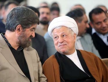 هاشمي رفسنجاني(إلى اليمين)