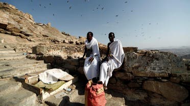 Muslim pilgrims from Somalia rest while they climb the Mount Al-Noor, where Prophet Mohammad received the first words of the Quran through Gabriel in the Hera cave. (Reuters)