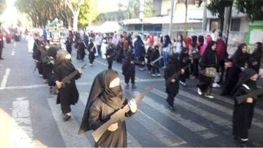 Preschool girls marched on the street wearing black from top to bottom with head and half face veils. (Twitter)