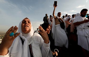 A Muslim pilgrim prays as she gather with others on Mount Mercy on the plains of Arafat during the annual haj pilgrimage, outside the holy city of Mecca. (Reuters)
