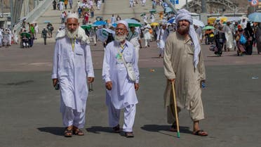 Muslim pilgrims walk towards Jamarat to cast stones at three huge stone pillars in the symbolic stoning of the devil on the last day of the annual hajj pilgrimage in Mina, outside the holy city of Mecca. (AP)