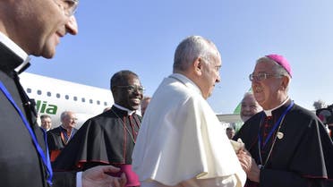 Pope Francis (C) being greeted by Archbishop of Dublin Diarmuid Martin on arrival at Dublin airport on August 25, 2018 to attend the 2018 World Meeting of Families. (AFP)
