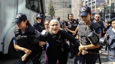Emine Ocak, a a member of Saturday Mothers Turkish group is detained by Turkish female riot police during a demonstration on August 25, 2018 in Istanbul (AFP)