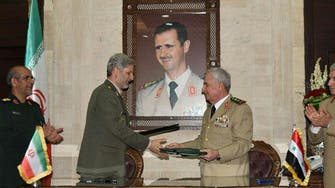 Iran and Syria sign defense, reconstruction deal 