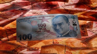 A 100 Turkish lira banknote is seen on top of 50 Turkish lira banknotes in this picture illustration in Istanbul. (Reuters)