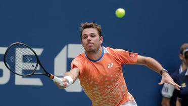 Stan Wawrinka, of Switzerland, returns a shot to Grigor Dimitrov, of Bulgaria, during the first round of the U.S. Open tennis tournament. (AP)