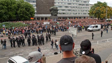Protesters gather for a far-right protest in front of the Karl Marx Monument in Chemnitz, Germany, Monday, Aug. 27, 2018. (AP)