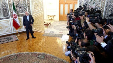 Iranian Foreign Minister Mohammad Javad Zarif waits to welcome European Union foreign policy chief Federica Mogherini in Tehran on April 16, 2016. (AP)