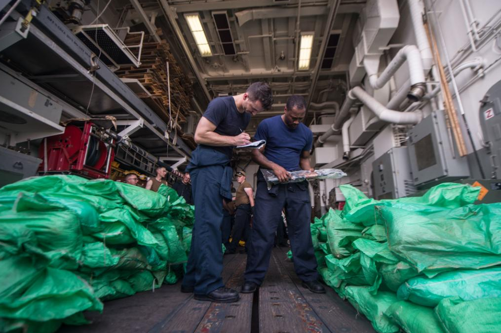 US navy siezes small arms on boat in gulf od Aden. (US Navy)